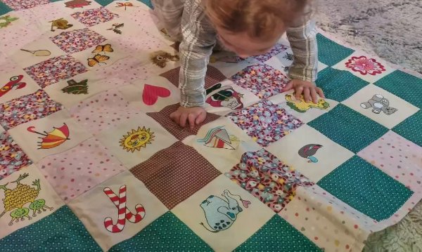 Baby Quilt with Embroidered Squares