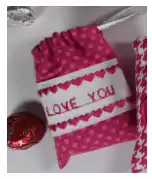 Valentine-candy-bags-text-and-hearts-close-up.png